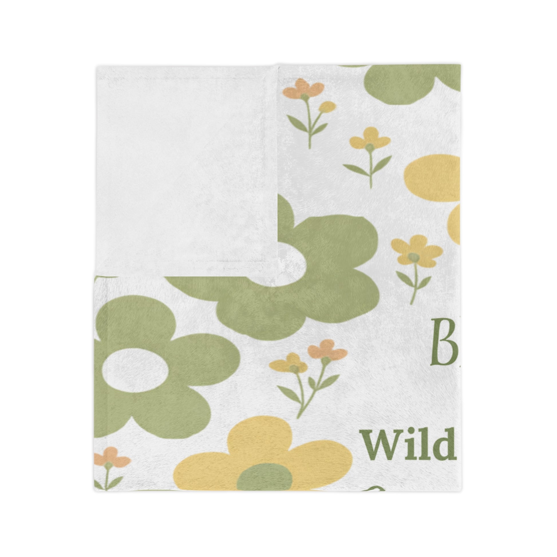 Folded velveteen microfiber baby blanket showing soft floral print and plush white reverse side